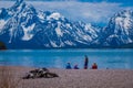 YELLOWSTONE, MONTANA, USA MAY 24, 2018: Tourist sitting in the ground enjoying the landscape of Grand Teton National