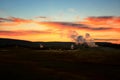 erupt geysers at dusk, Yellowstone, Wyoming