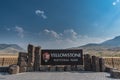 Yellowstone National Park Sign with Cloudy Blue Sky Royalty Free Stock Photo