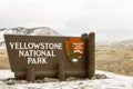 Yellowstone National Park sign at entrance in Wyoming in winter Royalty Free Stock Photo