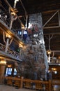 YELLOWSTONE NATIONAL PARK, WYOMING - JUNE 8, 2017: Rhyolite Fireplace and Brass & Iron Clock in the Lobby of Old Faithful Inn Royalty Free Stock Photo