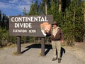 YELLOWSTONE NATIONAL PARK, WYOMING, USA - AUGUST 23, 2017:Male tourist standing in front of the Continental Divide sign Royalty Free Stock Photo