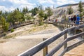 YELLOWSTONE NATIONAL PARK, WYOMING, USA - JULY 17, 2017: Tourists on boardwalk at Mammoth Hot Springs Terraces. Yellowstone Park,