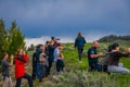 YELLOWSTONE NATIONAL PARK, WYOMING, USA - JUNE 07, 2018: Group of tourists using their cameras to take pictures of