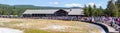 Yellowstone, Wyoming, USA, August 19, 2019, tourists gather around in front of the Yellowstone Lodge to watch the Old Faithful