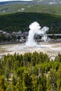 Yellowstone, Wyoming, USA, May, 25, 2021, tourists in the Upper Geyser Basin watching Old Faithful erupt