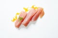 yellowtail sashimi against a white backdrop