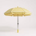 Yellowwhite striped beach umbrella on a white backdrop Royalty Free Stock Photo