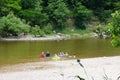 Distance view of people enjoying themselves in the shallow water of Buffalo River near Yellville, Arkansas, U.S