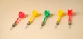 Yellw,green and red darts rests on background Royalty Free Stock Photo