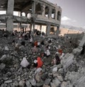 Yemeni children studying inside the destroyed area because of the war