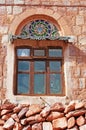 A yemeni old man behind a window in a red and decorated old house, Kawkaban, Republi Royalty Free Stock Photo