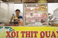 Yen Bai, Vietnam - Apr 12, 2014: Unidentified vendor sells bread with meat by the mobile cart on Yen Bai, Vietnam