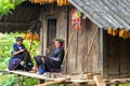 Yen Bai, Vietnam - Sep 17, 2016: Hmong ethnic minority women sewing clothing at their house