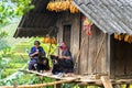 Yen Bai, Vietnam - Sep 17, 2016: Hmong ethnic minority women sewing clothing at their house
