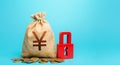 Yen Yuan money bag and red padlock. Blocking bank accounts and seizing assets. Tight government control over the financial system Royalty Free Stock Photo