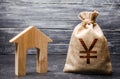 Yen yuan symbol money bag and house. Real estate purchase and investment. Affordable cheap loan, mortgage. Taxes, rental income