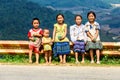 YENBAI, VIETNAM - MAY 16, 2014 - Ethnic unidentified children welcoming tourists while parents are working on the terraces.