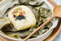 yeonnipbap, korean lotus leaf rice, Glutinous rice, dates, and chestnuts wrapped in a lotus leaf and steamed in a steamer. In the
