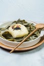 yeonnipbap, korean lotus leaf rice, Glutinous rice, dates, and chestnuts wrapped in a lotus leaf and steamed in a steamer. In the