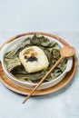 yeonnipbap, korean lotus leaf rice, Glutinous rice, dates, and chestnuts wrapped in a lotus leaf and steamed in a steamer. In the