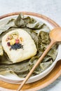 yeonnipbap, korean lotus leaf rice, Glutinous rice, dates, and chestnuts wrapped in a lotus leaf and steamed in a steamer. In the