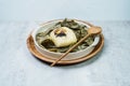 yeonnipbap, korean lotus leaf rice, Glutinous rice, dates, and chestnuts wrapped in a lotus leaf and steamed in a steamer. In the