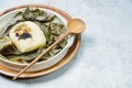 yeonnipbap, korean lotus leaf rice, Glutinous rice, dates, and chestnuts wrapped in a lotus leaf and steamed in a steamer. In the