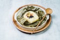 yeonnipbap, korean lotus leaf rice, Glutinous rice, dates, and chestnuts wrapped in a lotus leaf and steamed in a steamer. In the