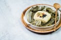 yeonnipbap, korean lotus leaf rice, Glutinous rice, dates, and chestnuts wrapped in a lotus leaf and steamed in a steamer. In the