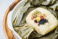 yeonnipbap, korean lotus leaf rice, Glutinous rice, dates, and chestnuts wrapped in a lotus leaf and steamed in a steamer. In the