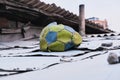 Yerevan, Armenia, Alexander Kirillov - 30082019: Cond, Torn soccer ball on the roof of the house Royalty Free Stock Photo