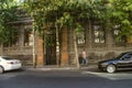 Old building of black tuff decorated with red tuff with wrought iron bars on the Windows and doors on Khorenatsi street in Yerevan