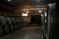 YEREVAN, ARMENIA - DECEMBER 30, 2016: Wooden barrels of aged cognac at cellar of Brandy Factory Noy of Yerevan Royalty Free Stock Photo