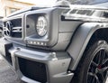 Yerevan, Armenia, February 25, 2023: Mercedes G-Class G-63. Close-up of the headlights detail. Side view matt gray Mercedes Benz G