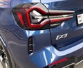 Yerevan, Armenia, June 10, 2023: Close up BMW iX3 tail light and logo. BMW iX3 with electric drive. All-electric compact SUV