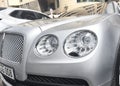 Yerevan, Armenia, March 10, 2023: Premium class car Bentley Flying Spur exterior in a city street. Bentley headlight