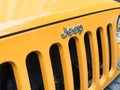 Yerevan, Armenia, May 20, 2023: Jeep logo on a car. Closeup of Jeep logo on yellow car