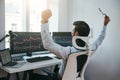 Yes Back view of stock trader with raised hands looking at multiple computer screens with data and charts and feeling Royalty Free Stock Photo