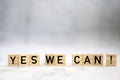 Yes we can text wooden cubes . Positive thinking, motivation, attitude and confidence concept. bright background texture Royalty Free Stock Photo