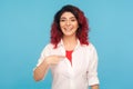 Yes, choose me! Portrait of charming hipster woman with fancy red hair pointing herself and smiling