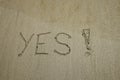 YES concept, positive changes in the life, word written on sand beach Royalty Free Stock Photo