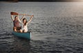 Yes we did it. a young couple rowing a boat out on the lake. Royalty Free Stock Photo