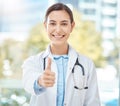 Yes, doctor success and thank you thumbs up of a woman with a winner, happy and support hand sign. Portrait of a medical