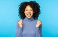 Yes, I did it! Excited Afro American woman screaming with joy celebrating victory win success, clenching her fists, rejoicing Royalty Free Stock Photo