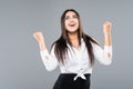 Yes, i win. Happiness optimistic businesswoman rejoicing victory isolated on grey background