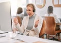 Yes Im happy that youre happy. an attractive mature call center agent wearing a headset and cheering while working on Royalty Free Stock Photo