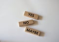 Yes No Maybe symbol. Concept word Yes No Maybe on wooden blocks. Beautiful white background. Business and Yes No Maybe concept. Royalty Free Stock Photo