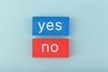 Yes and no written on blue and red rectangles. Concept of positive and negative answer Royalty Free Stock Photo