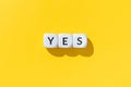 Yes word on white cube blocks isolated Royalty Free Stock Photo